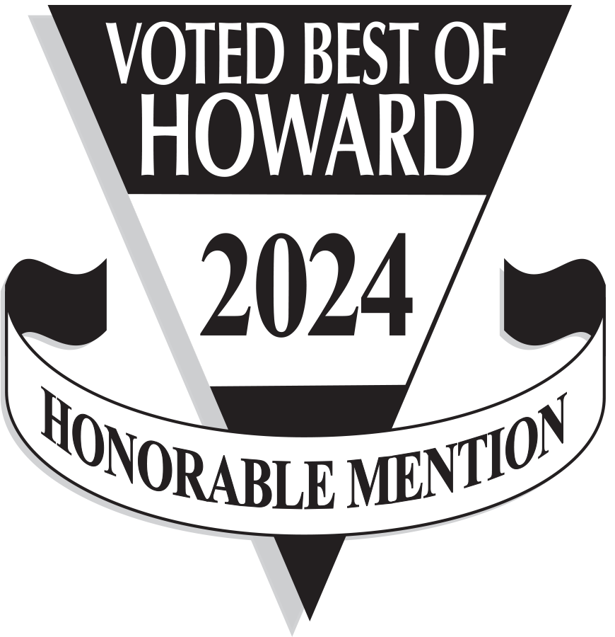 Define Hair & Skin in Ellicott City, MD A triangular badge with "Voted Best of Howard 2024 Honorable Mention" written on it in black and white, reflecting a proud milestone in our story.